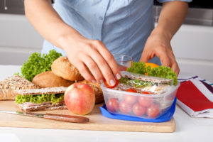 Sandwich being prepared on a cutting board